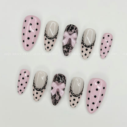 Dotty Darling - Handcrafted Pastel Pink French Polka Dot and Coquette Lace Press-On Nail Set Displayed at an Angle