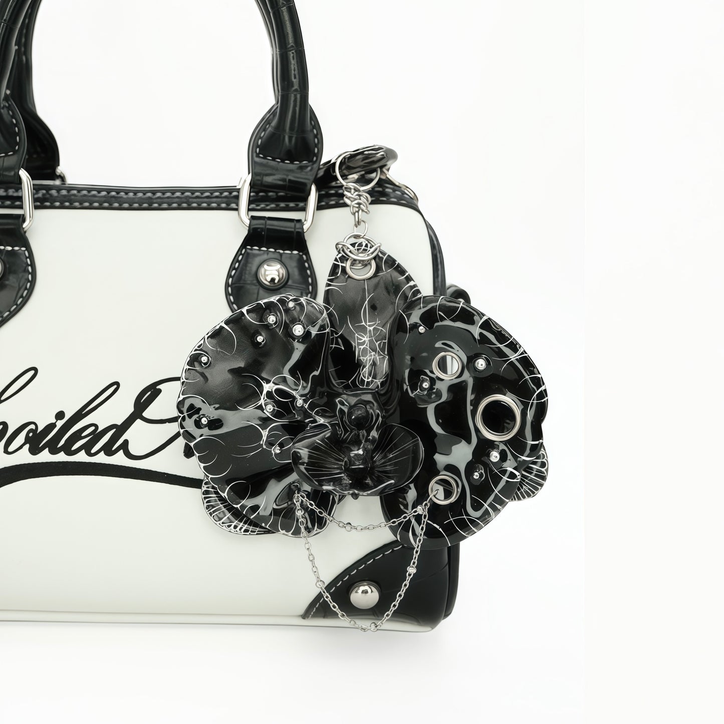 Orchid.exe - Avant-Garde Black Orchid Statement Bag Charm Featuring Draped Silver Chains and Piercing Rings