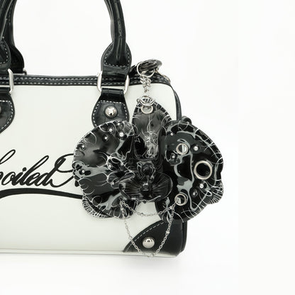 Orchid.exe - Avant-Garde Black Orchid Statement Bag Charm Featuring Draped Silver Chains and Piercing Rings