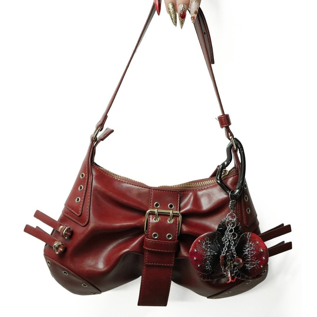 Red Voltage - High-Fashion Handcrafted Sculpted Orchid Charm Showcased on a Designer Shoulder Bag