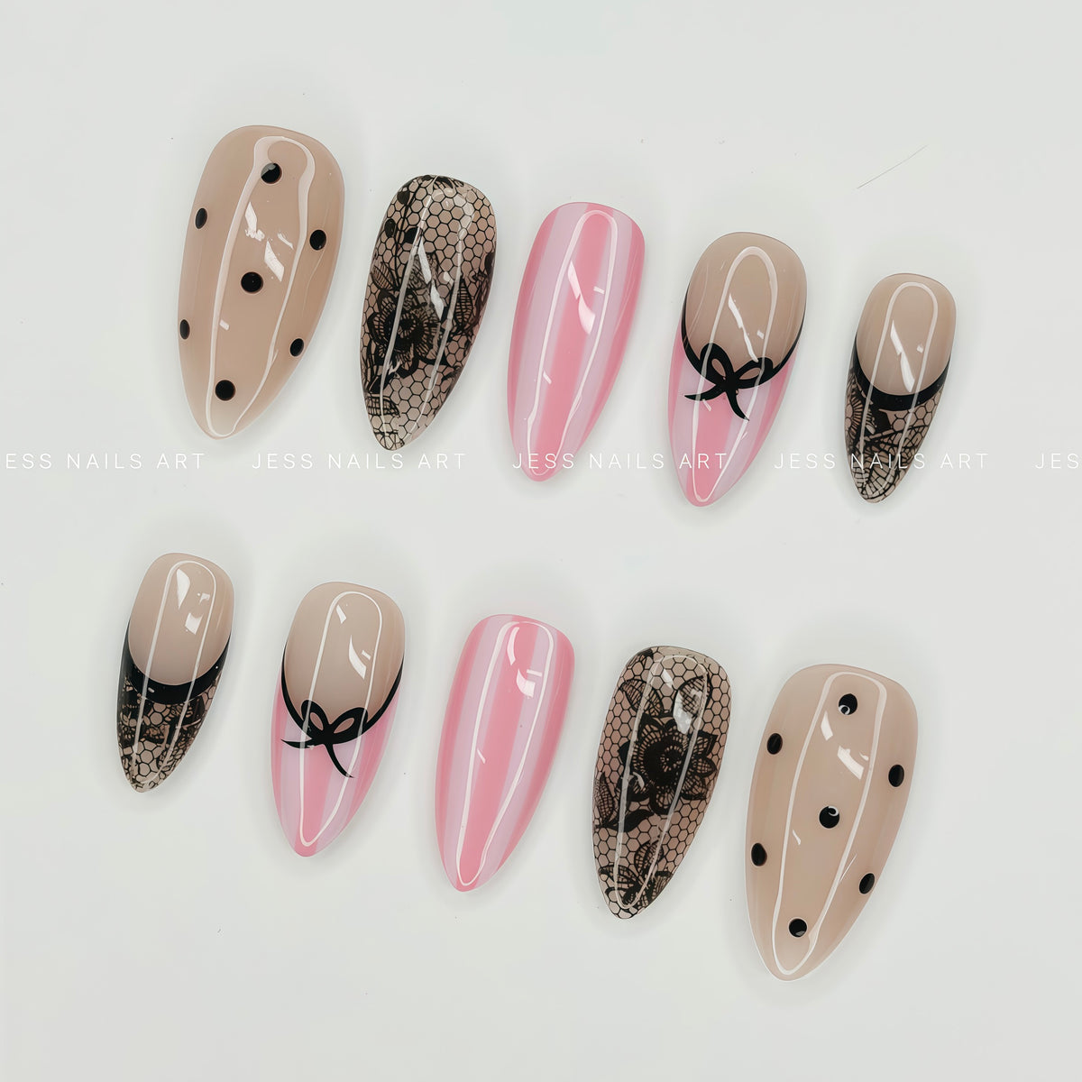 Dot Crush - Handcrafted French Coquette Press-On Nail Set with Hand-Painted Black Bow and Fishnet Lace Displayed at an Angle