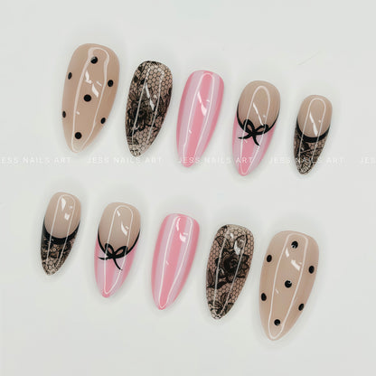 Dot Crush - Handcrafted French Coquette Press-On Nail Set with Hand-Painted Black Bow and Fishnet Lace Displayed at an Angle