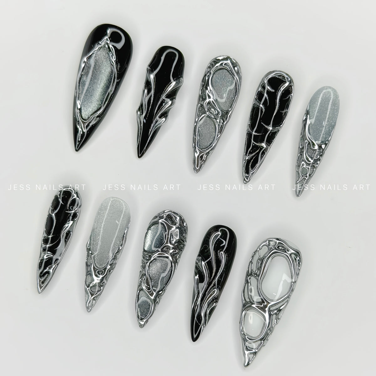 Chrome Relic - Handcrafted Cyberpunk 3D Liquid Metal Frame and Silver Velvet Cat-Eye Press-On Nail Set Displayed at an Angle