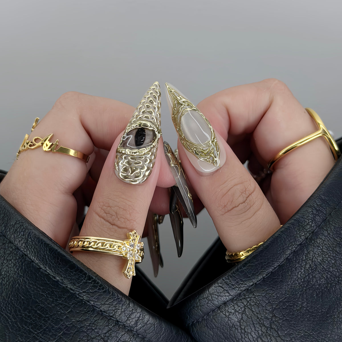 Draconic - Close-Up Shot of 3D Gold Chrome Dragon Eye Thumb Nail and Intricate Tribal Gold Line Work