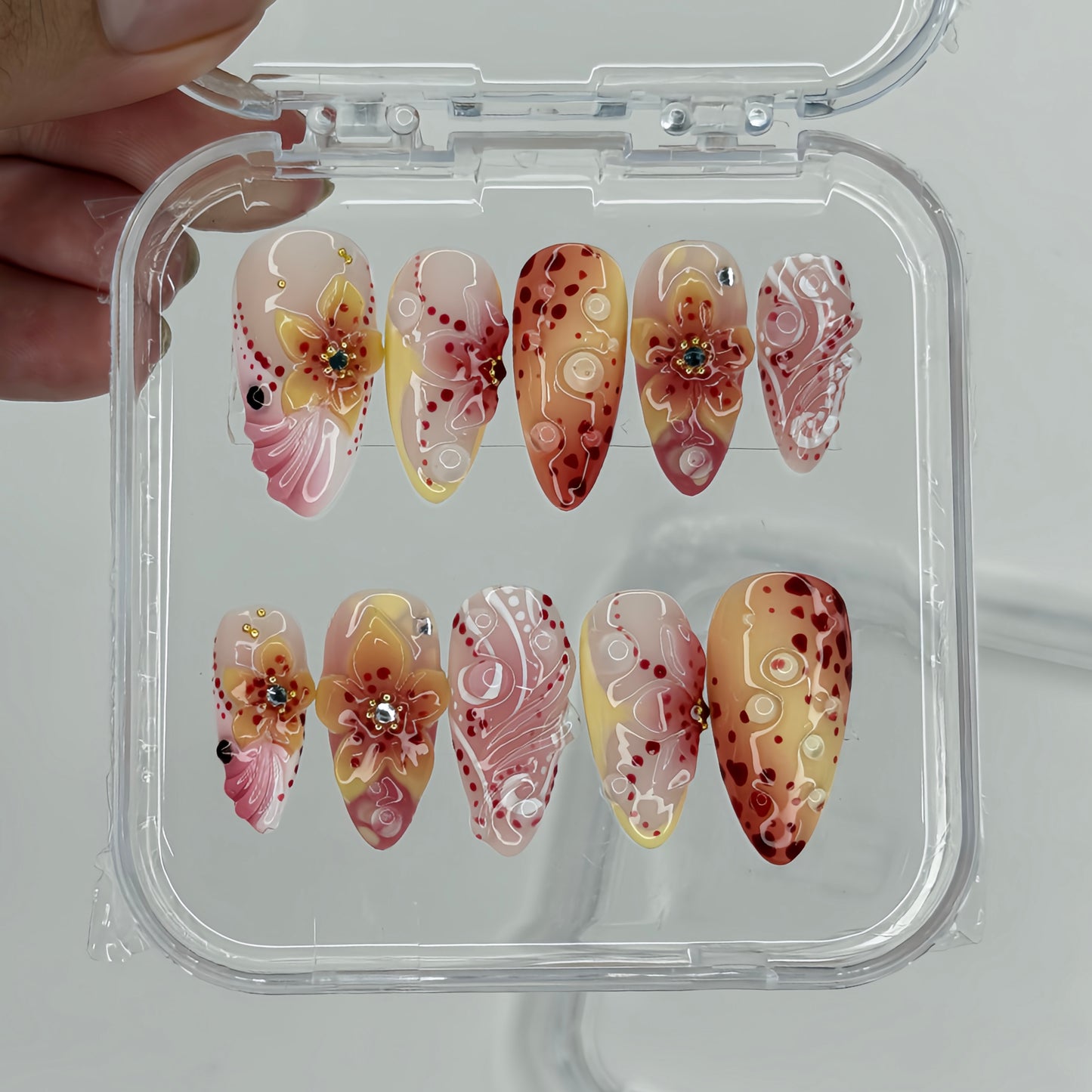 Crimson Bloom Fairy - Handcrafted Press-On Nails Set in Clear Display Case Featuring 3D Sculpted Crimson Flowers, Mango Yellow Ombre, and Gel Dewdrops
