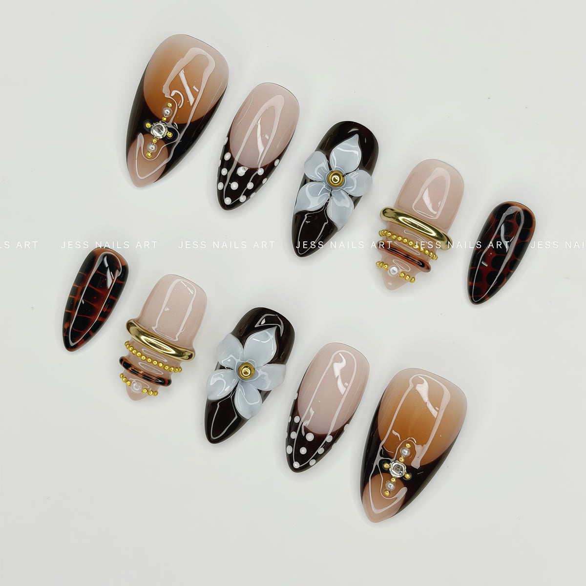 Cafe Nostalgia - Handcrafted Luxury Brown and Nude Press-On Nail Set Featuring 3D Glass Flowers and Gold Studs Displayed at an Angle