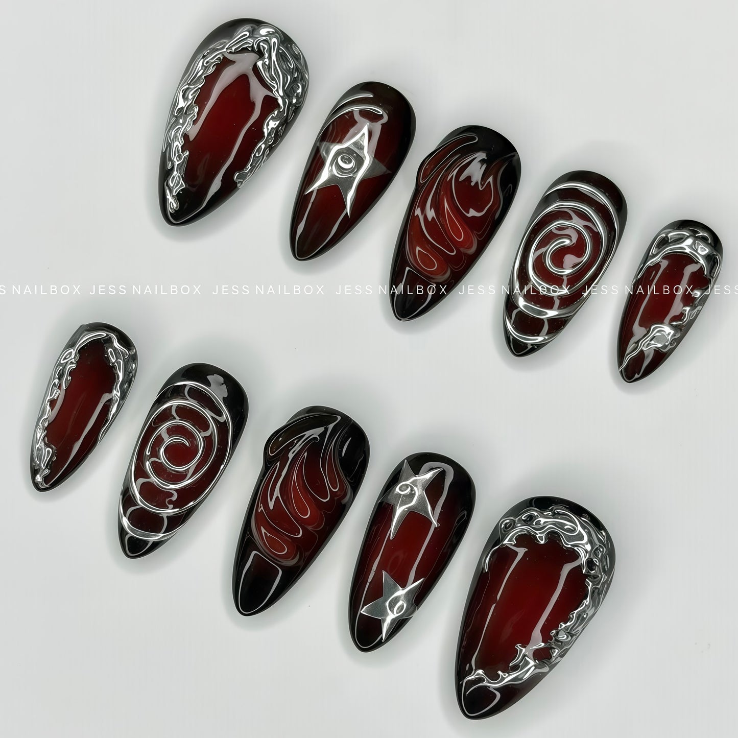 Close-up of cyber sigilism liquid metal accents and 3D textured gel art on almond press-on nails.