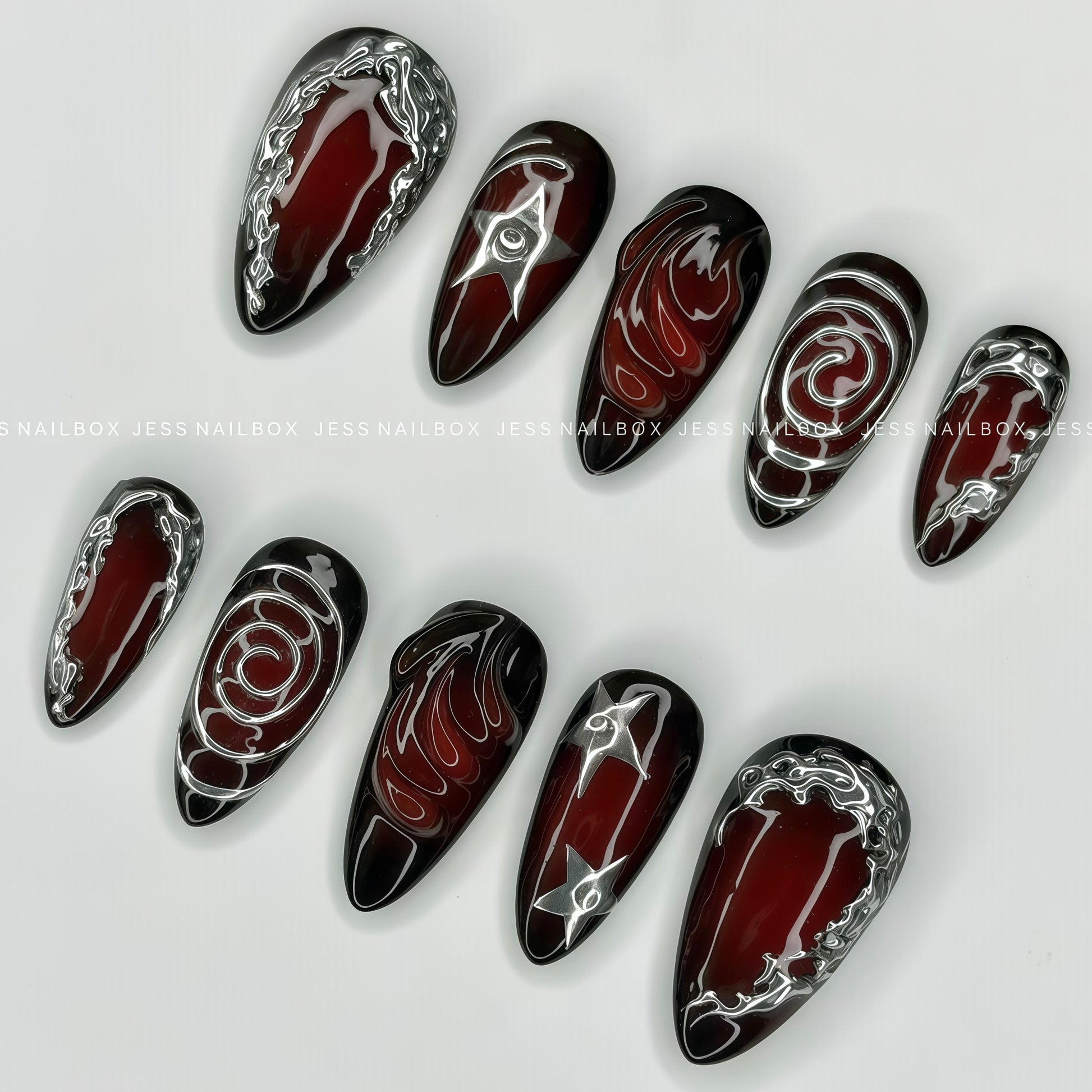 Close-up of cyber sigilism liquid metal accents and 3D textured gel art on almond press-on nails.
